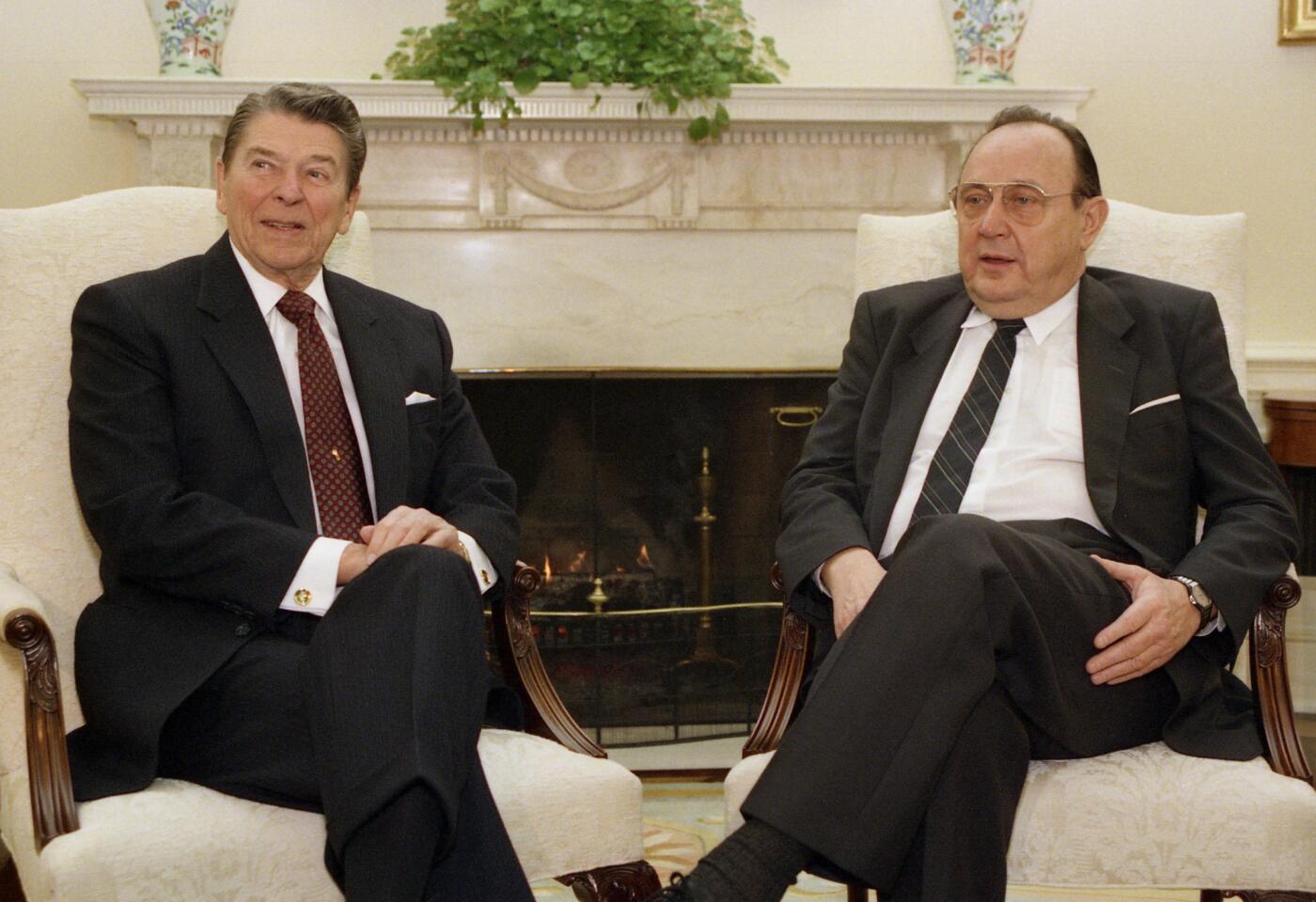 Hans-Dietrich Genscher, West Germany's long-serving foreign minister, visits President Reagan in the Oval Office in 1988.