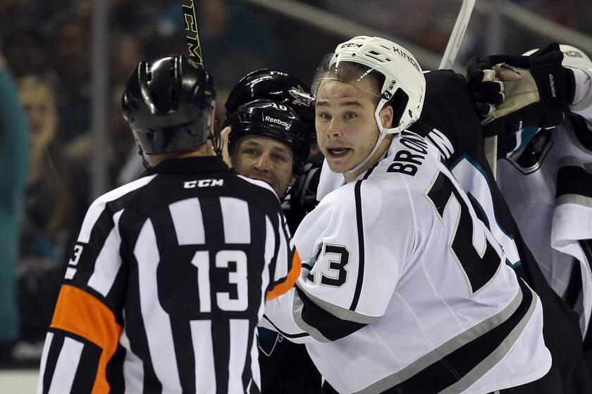 Kings captain Dustin Brown complains to referee Dan O'Halloran in the third period of Game 2 of the first-round playoff series against the Sharks on Sunday night at SAP Center in San Jose.