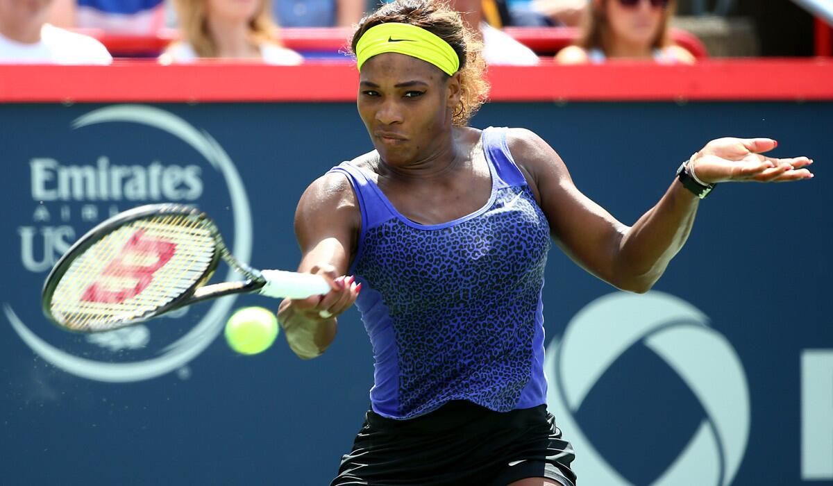 Serena Williams returns a shot against Caroline Wozniacki in a quarterfinal match at the Rogers Cup on Friday.