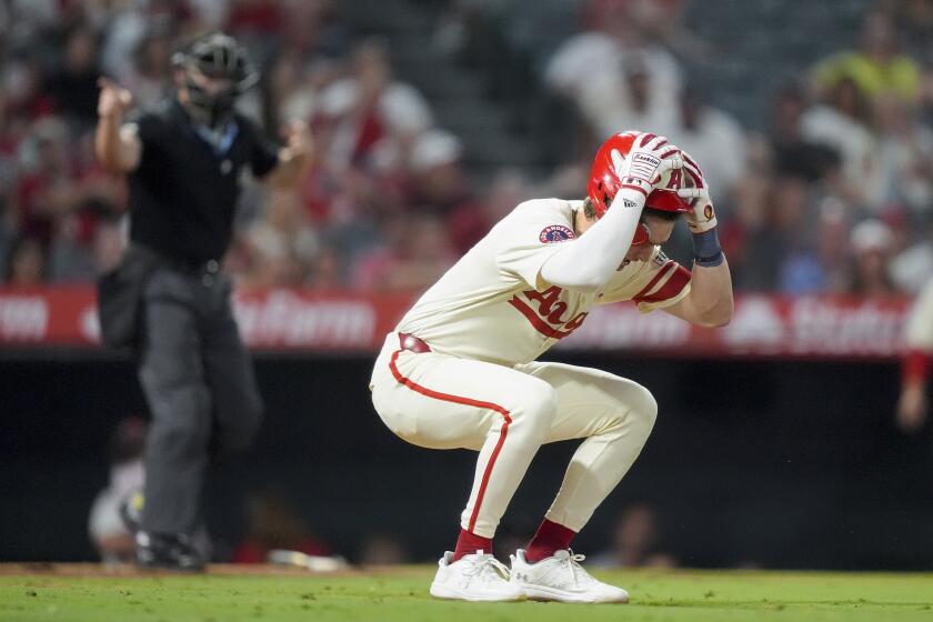 Angels' Mickey Moniak reacts after a pitch during the ninth inning of a loss to New York Mets