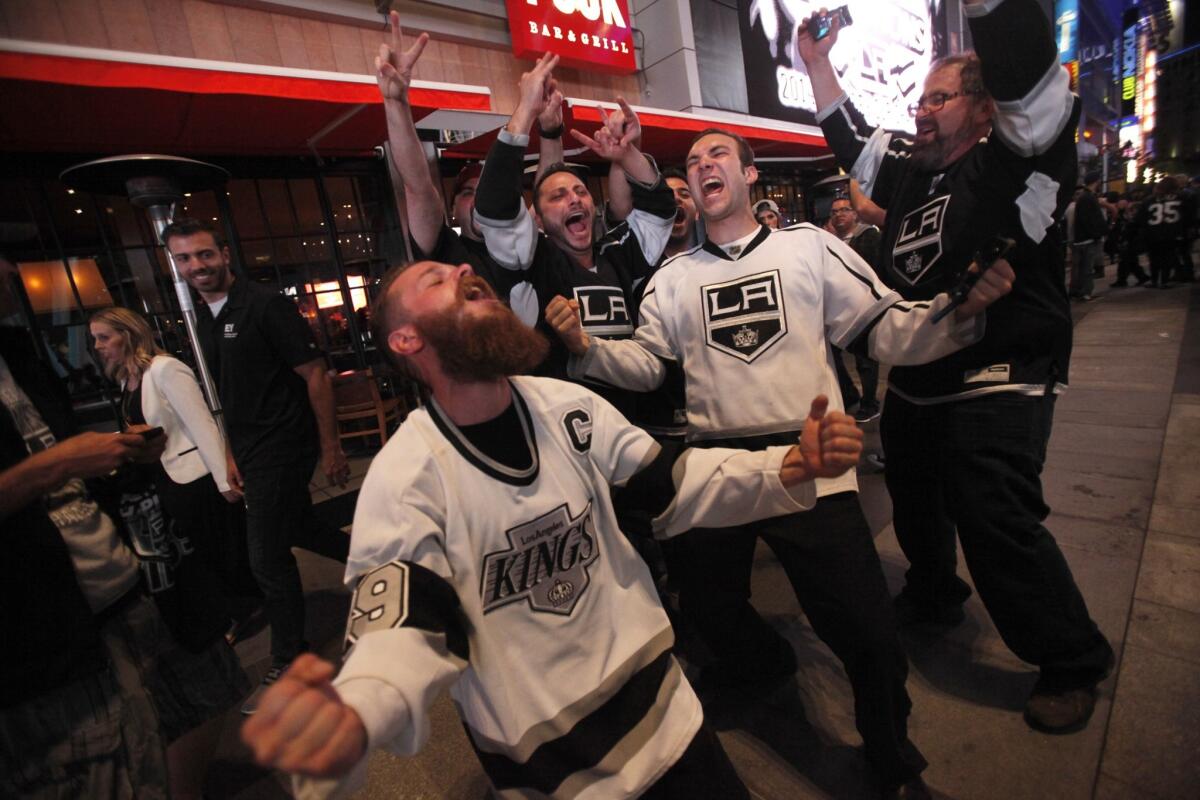 Kings fans outside Staples Center celebrate the Stanley Cup win.