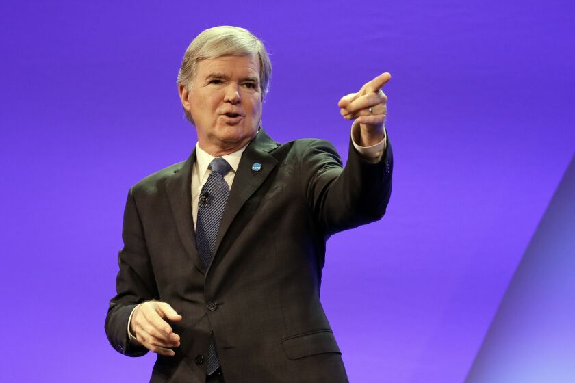 FILE - NCAA President Mark Emmert speaks at the opening business session of the NCAA convention Jan. 19, 2017, in Nashville, Tenn. Emmert is stepping down after 12 years on the job. NCAA Board of Governors Chairman John DeGioia announced the move Tuesday, April 26, 2022, and said it was by mutual agreement. Emmert will continue to serve in his role until a new president is selected and in place or until June 30, 2023. (AP Photo/Mark Humphrey, File)