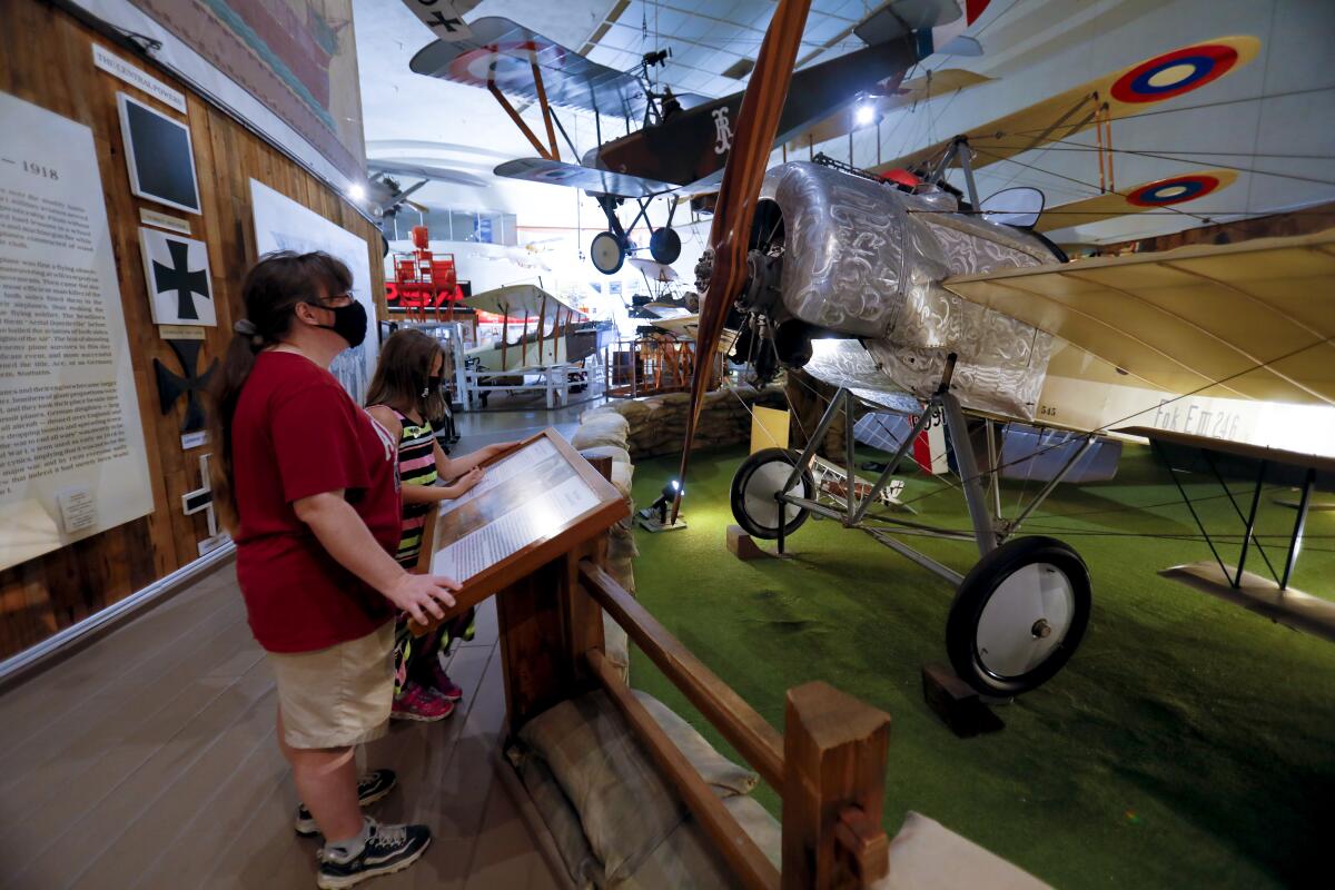Heather Llanes and Ariana Llanes, 10, browse the San Diego Air & Space Museum.