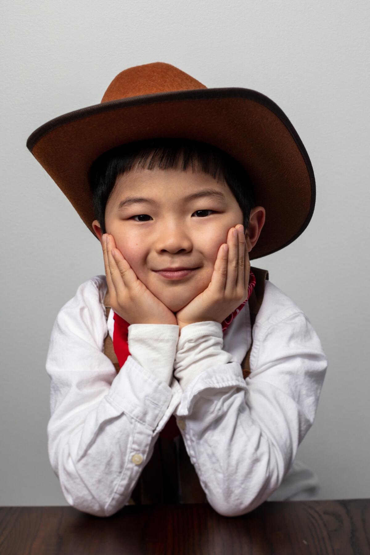 8-year-old Alan Kim of “Minari,” shows off his cowboy duds.