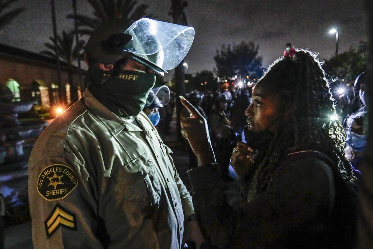 Protesters at the South L.A. Sheriff's Station hours after a Black man was fatally shot by deputies.