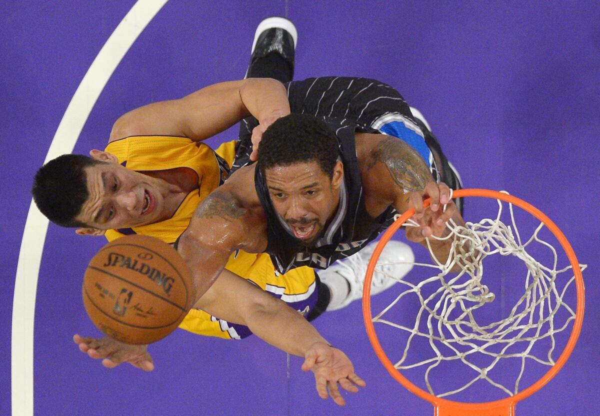 Lakers guard Jeremy Lin puts up a shot as Orlando's Channing Frye defends during a Jan. 9 game at Staples Center.