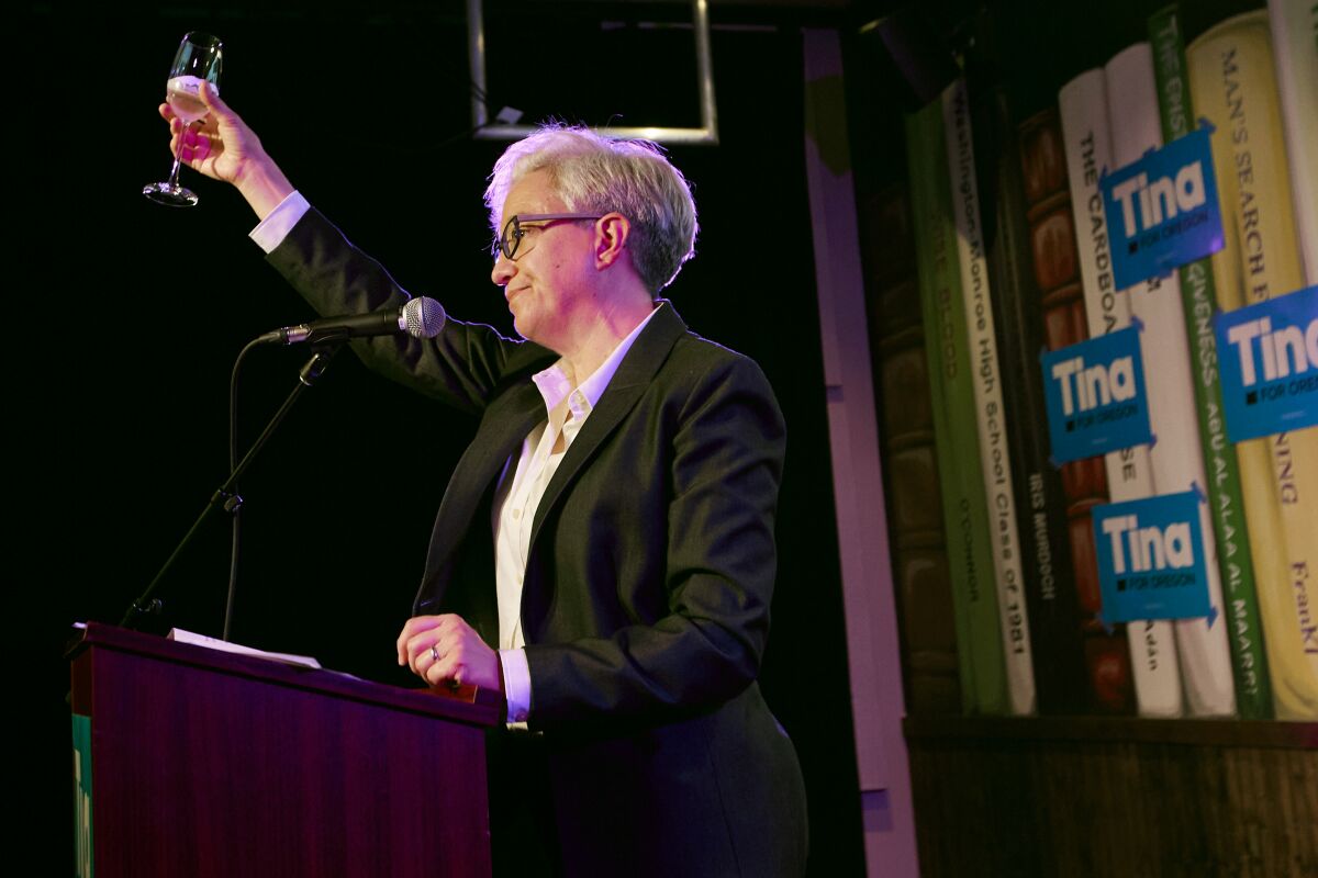 Democratic gubernatorial candidate Tina Kotek toasts her supporters after the results of Oregon's primary election are announced in Portland, Ore., Tuesday May 17, 2022. Kotek defeated Tobias Read to win the nomination. (AP Photo/Craig Mitchelldyer)
