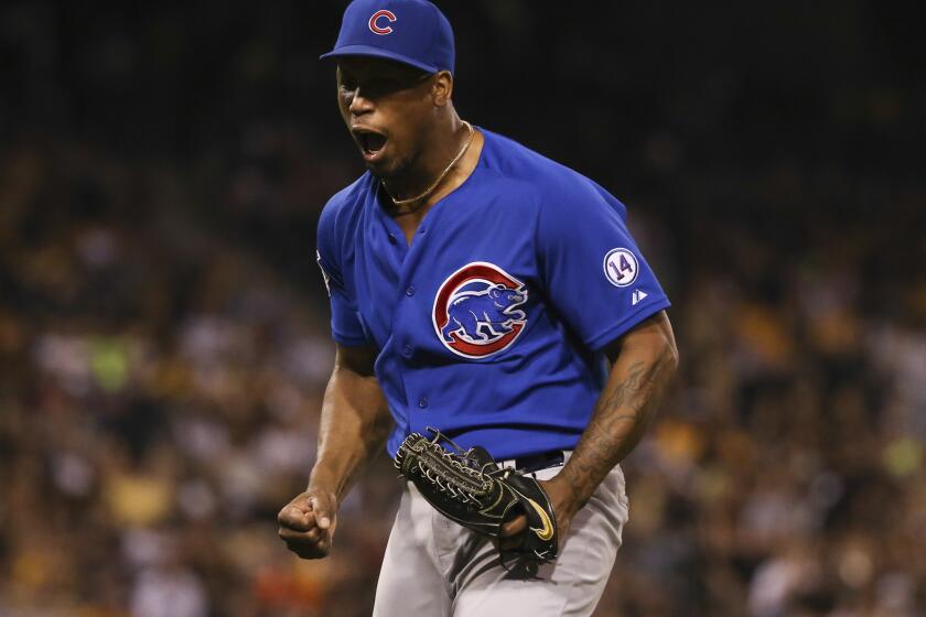 Cubs relief pitcher Pedro Strop reacts after getting out of the ninth inning.
