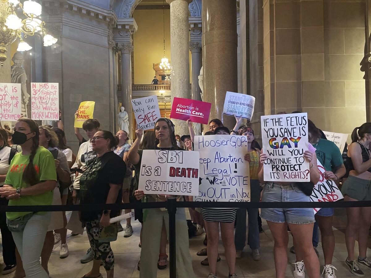 FILE - Abortion-rights protesters fill Indiana Statehouse corridors outside legislative chambers on Aug. 5, 2022, as lawmakers vote to concur on a near-total abortion ban, in Indianapolis. Indiana’s new abortion ban will make nearly all abortions illegal in the state as of Thursday, Sept. 15, putting into effect a law that made it the first state where the Legislature and governor approved such a measure since the U.S. Supreme Court overturned Roe v. Wade in June. (AP Photo/Arleigh Rodgers, File)