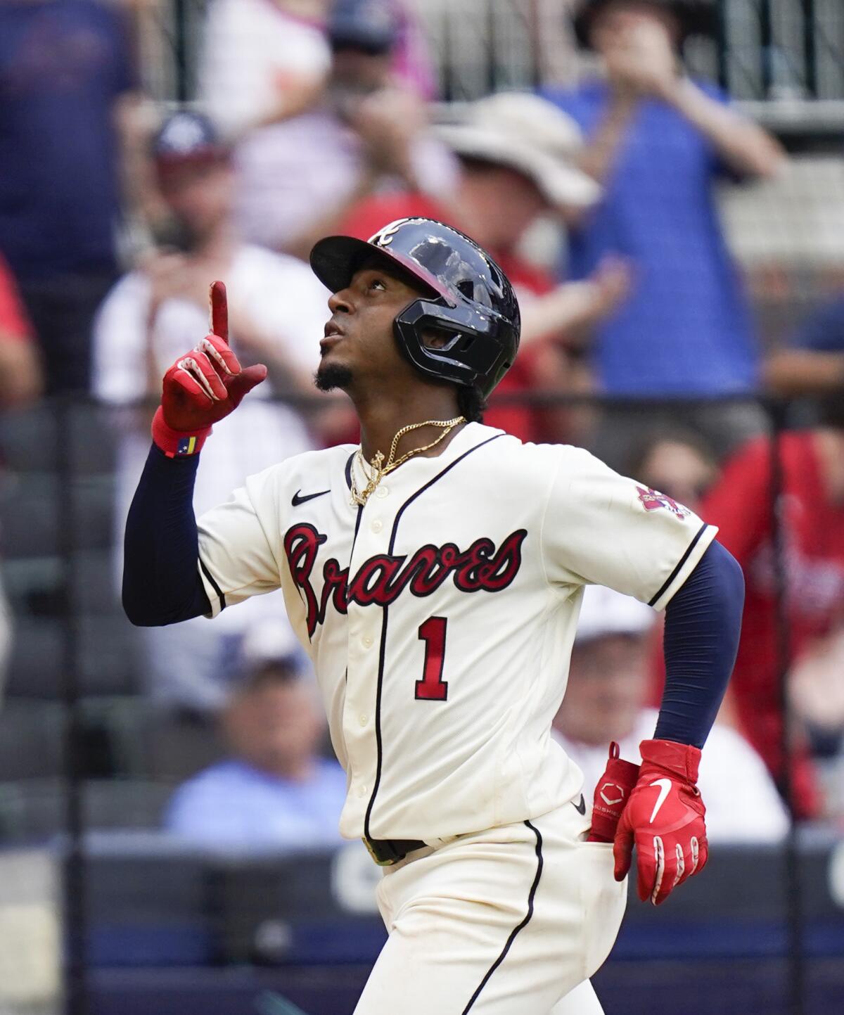 Atlanta Braves' Ozzie Albies (1) celebrates after hitting a home run in the third inning of a baseball game against the Washington Nationals Sunday, Aug. 8, 2021, in Atlanta. (AP Photo/Brynn Anderson)