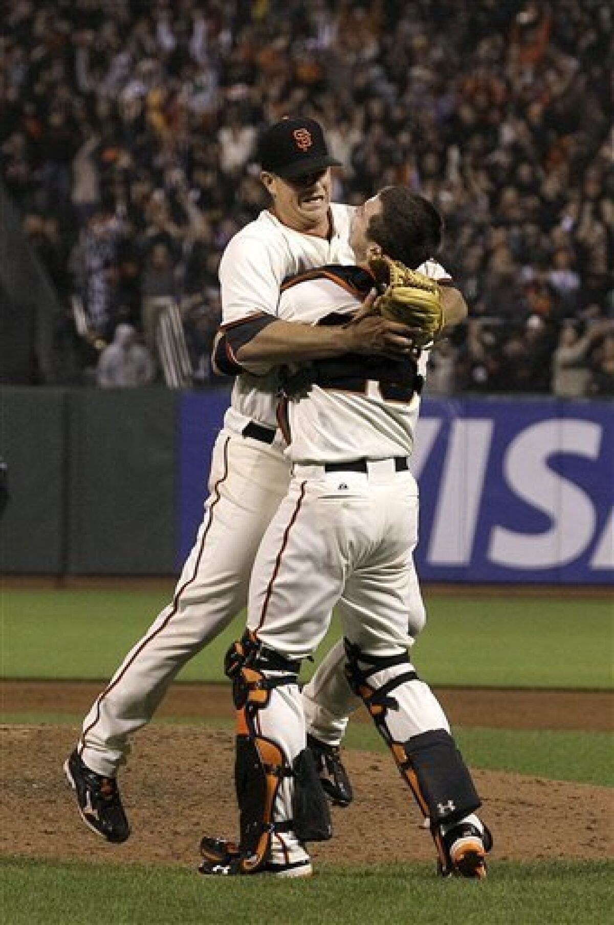 San Francisco Giants pitcher Matt Cain, left, celebrates with catcher Buster Posey after the final out of the ninth inning of a baseball game against the Houston Astros in San Francisco, Wednesday, June 13, 2012. Cain pitched the 22nd perfect game in major league history and first for the Giants, striking out a career-high 14 and getting help from two spectacular catches to beat the Houston Astros 10-0. (AP Photo/Jeff Chiu)