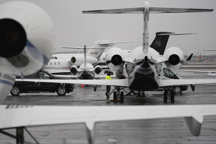 Planes are parked at a private jet terminal at Harry Reid International Airport ahead of the Super Bowl.
