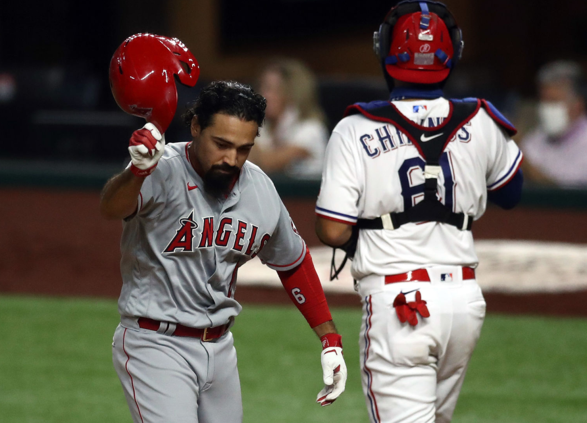 Angels third baseman Anthony Rendon throws off his helmet after striking out against the Texas Rangers.