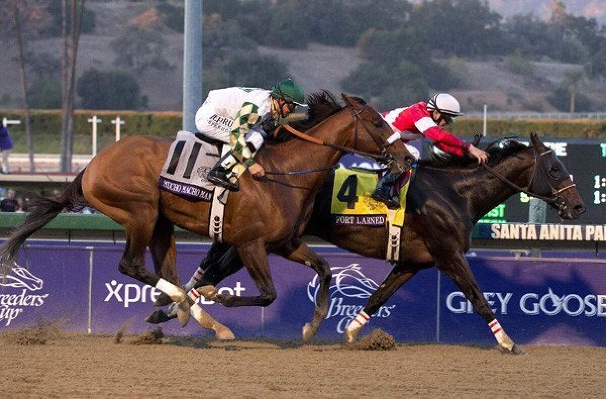 Fort Larned and jockey Brian Hernandez holds off Mucho Macho Man with Mike Smith aboard to win the Breeders' Cup Classic on Saturday evening at Santa Anita.