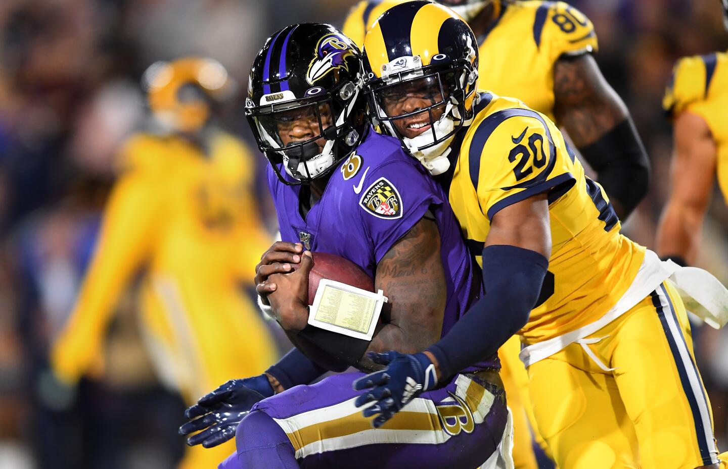 Ravens quarterback Lamar Jackson is stopped short of the goal line by the Rams' Jalen Ramsey during the second quarter of a game Nov. 25 at the Coliseum.