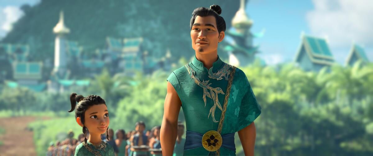 Raya (voiced by Kelly Marie Tran) and Chief Benja (voiced by Daniel Dae Kim) in the movie "Raya and the Last Dragon."