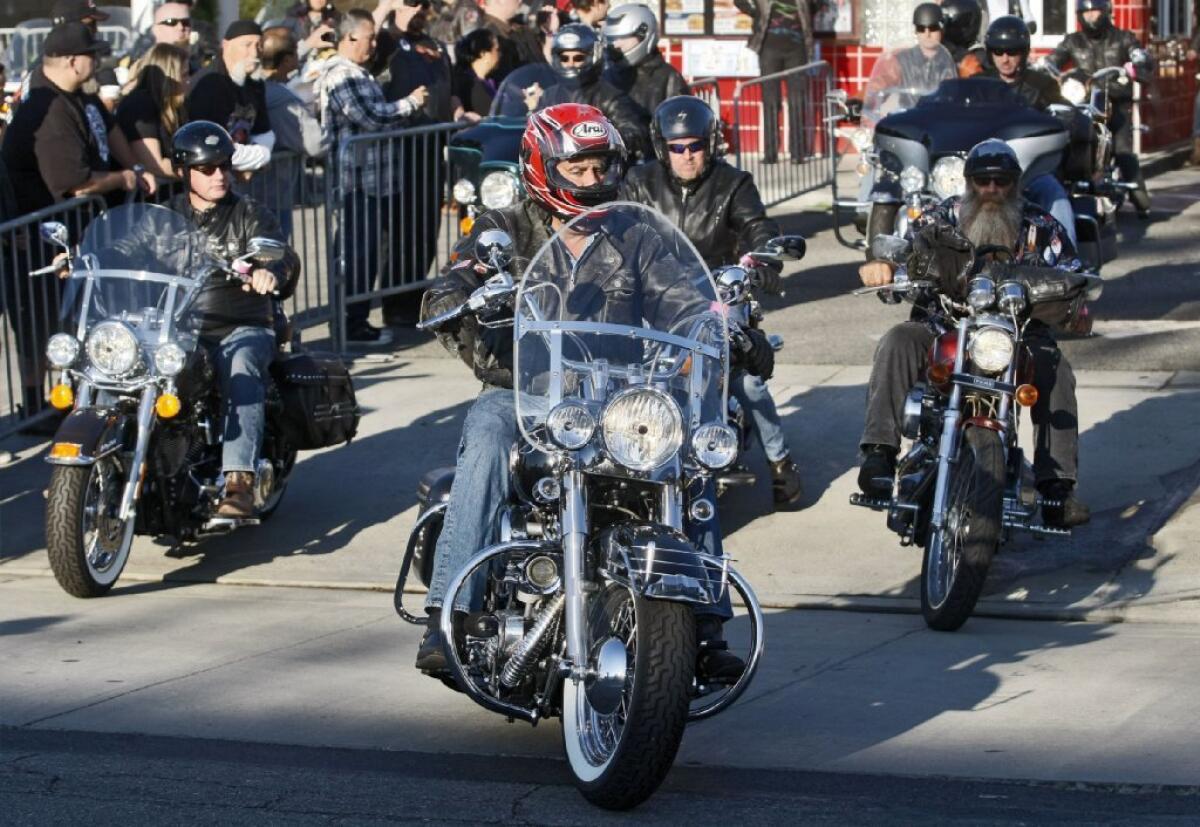 Comedian Jay Leno, center, leads the way from Harley-Davidson of Glendale in the 30th annual Love Ride.