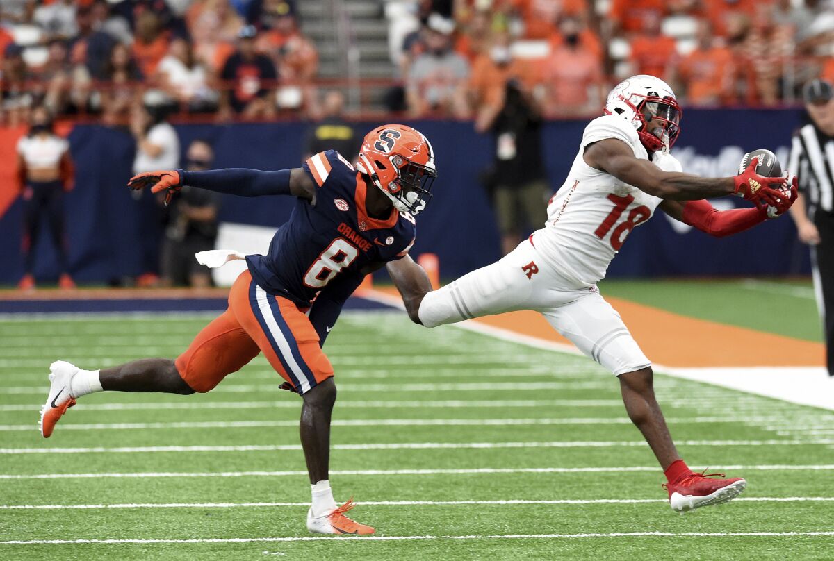 Syracuse defensive back Garrett Williams (8) chases down Rutgers wide receiver Bo Melton (18) in the second half of an NCAA college football game, Saturday, Sept. 11, 2021, at the Carrier Dome in Syracuse, N.Y. (Dennis Nett/The Post-Standard via AP)