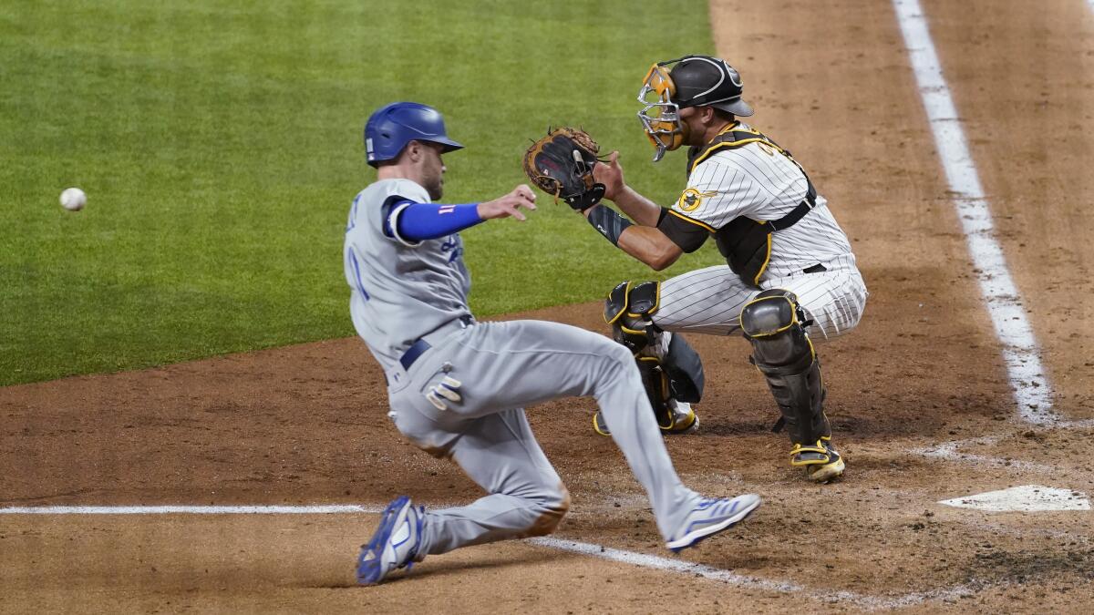 AJ Pollock, left, scores on a single by Joc Pederson during the third inning in Game 3 of the NLDS on Thursday.
