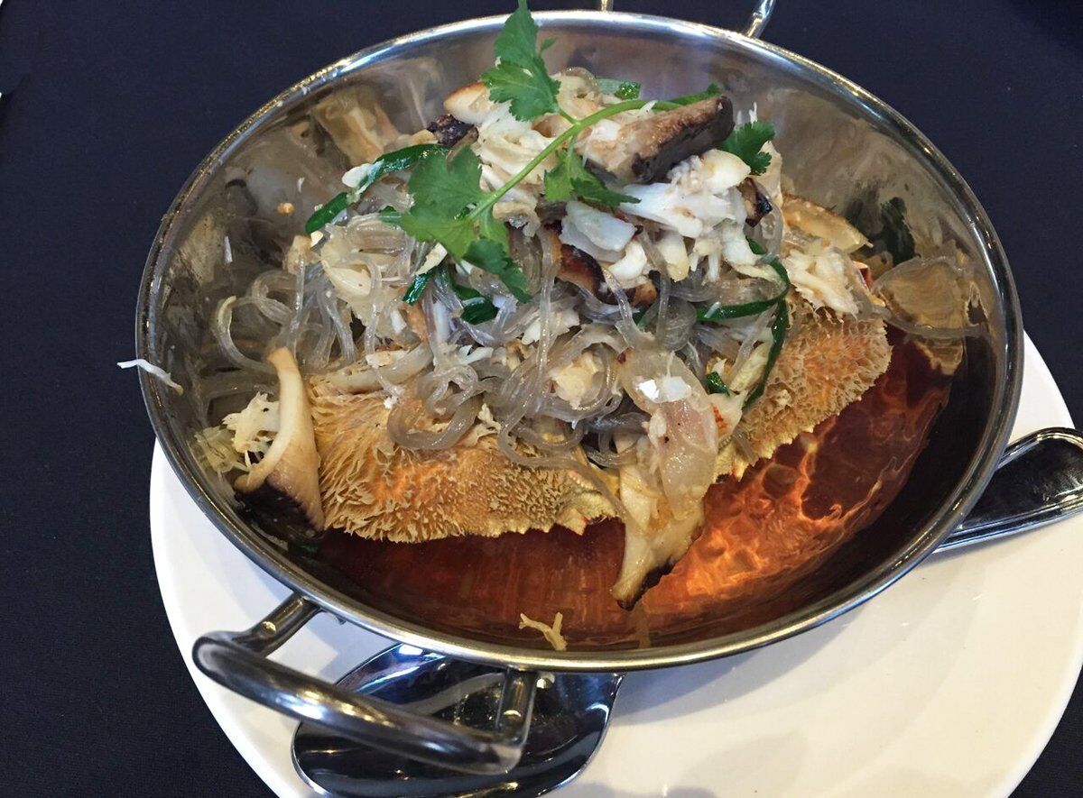 Dungeness crab with glass noodles, served in the upended crab's shell at Sovereign restaurant in the Gaslamp Quarter. — Pam Kragen