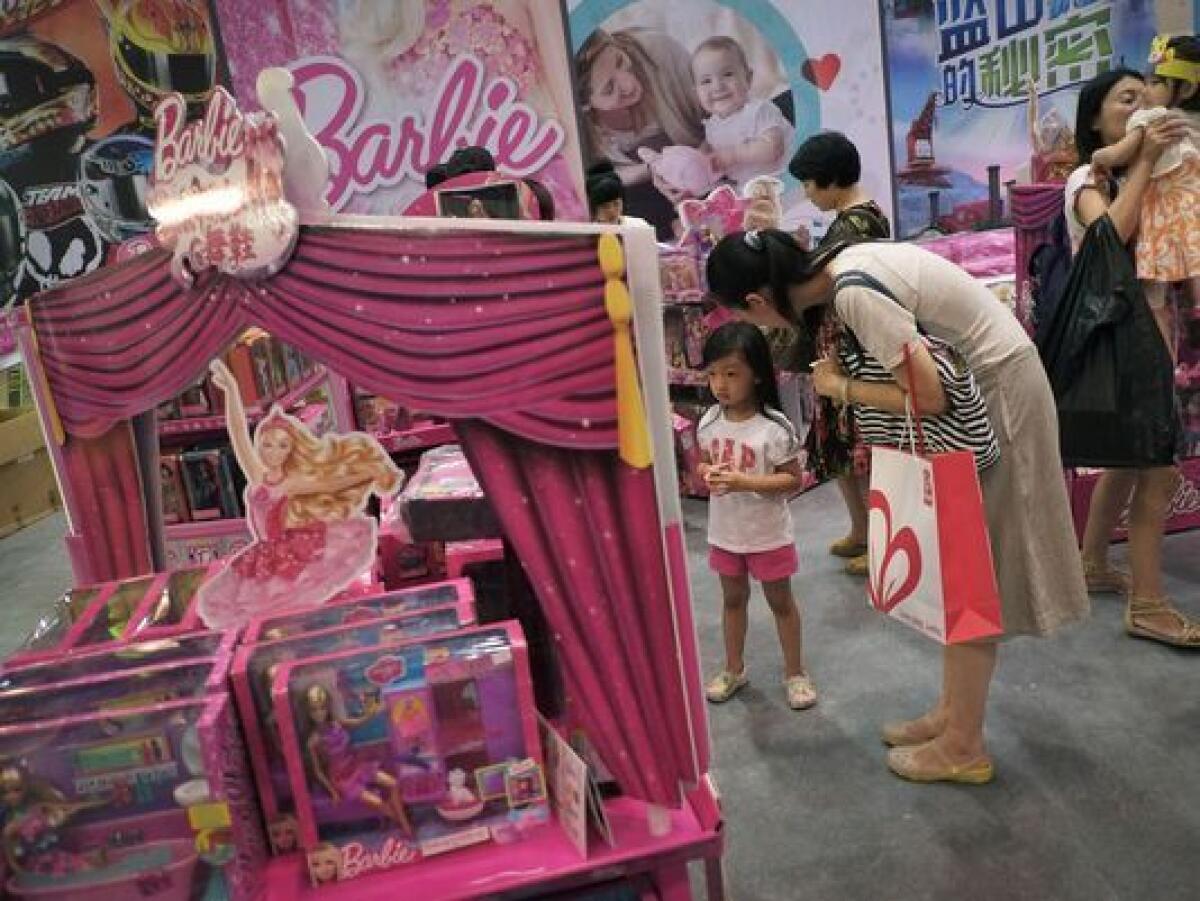 Barbie toys on display in Beijing. Mattel earnings for the holiday season disappointed the company and analysts.