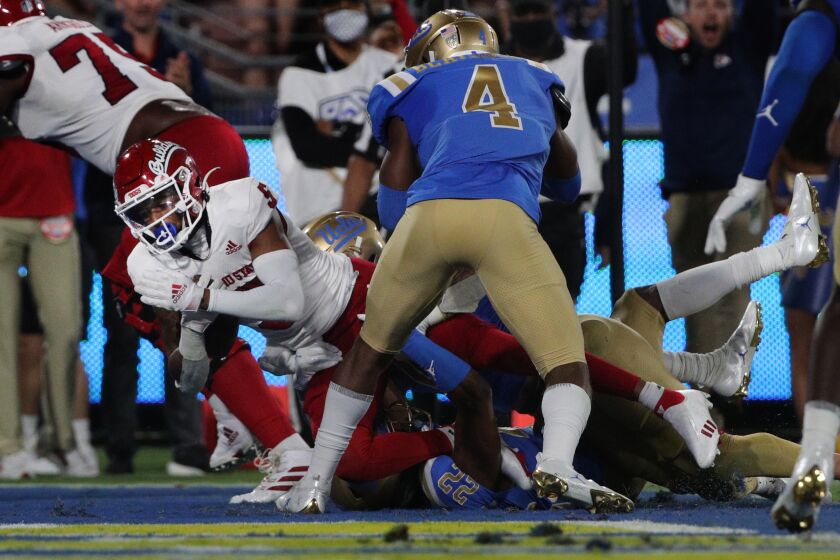 PASADENA, CA - SEPTEMBER 18, 2021: Fresno State Bulldogs wide receiver Jalen Cropper (5) dives into the end zone against UCLA Bruins defensive back Stephan Blaylock (4) at the Rose Bowl on September 18, 2021 in Pasadena, California.(Gina Ferazzi / Los Angeles Times)