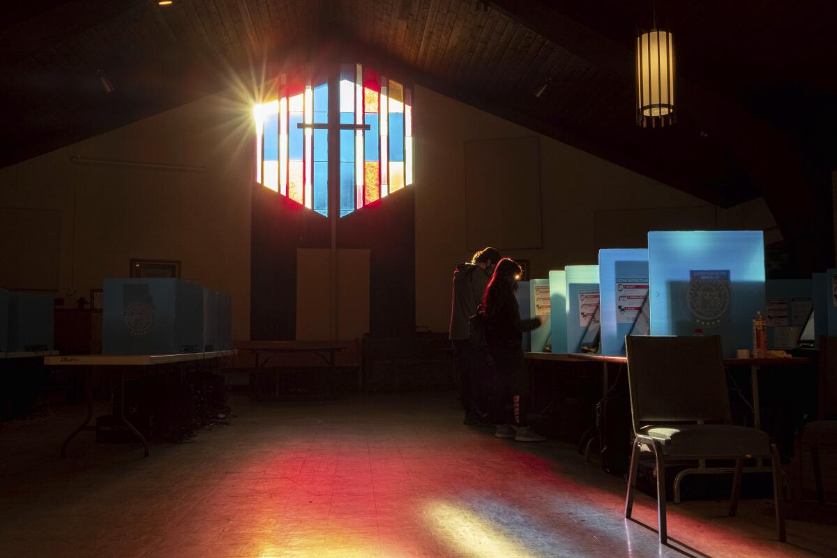 Voters mark their ballots at the Lawrenceville Road United Methodist Church in Tucker, Ga. 