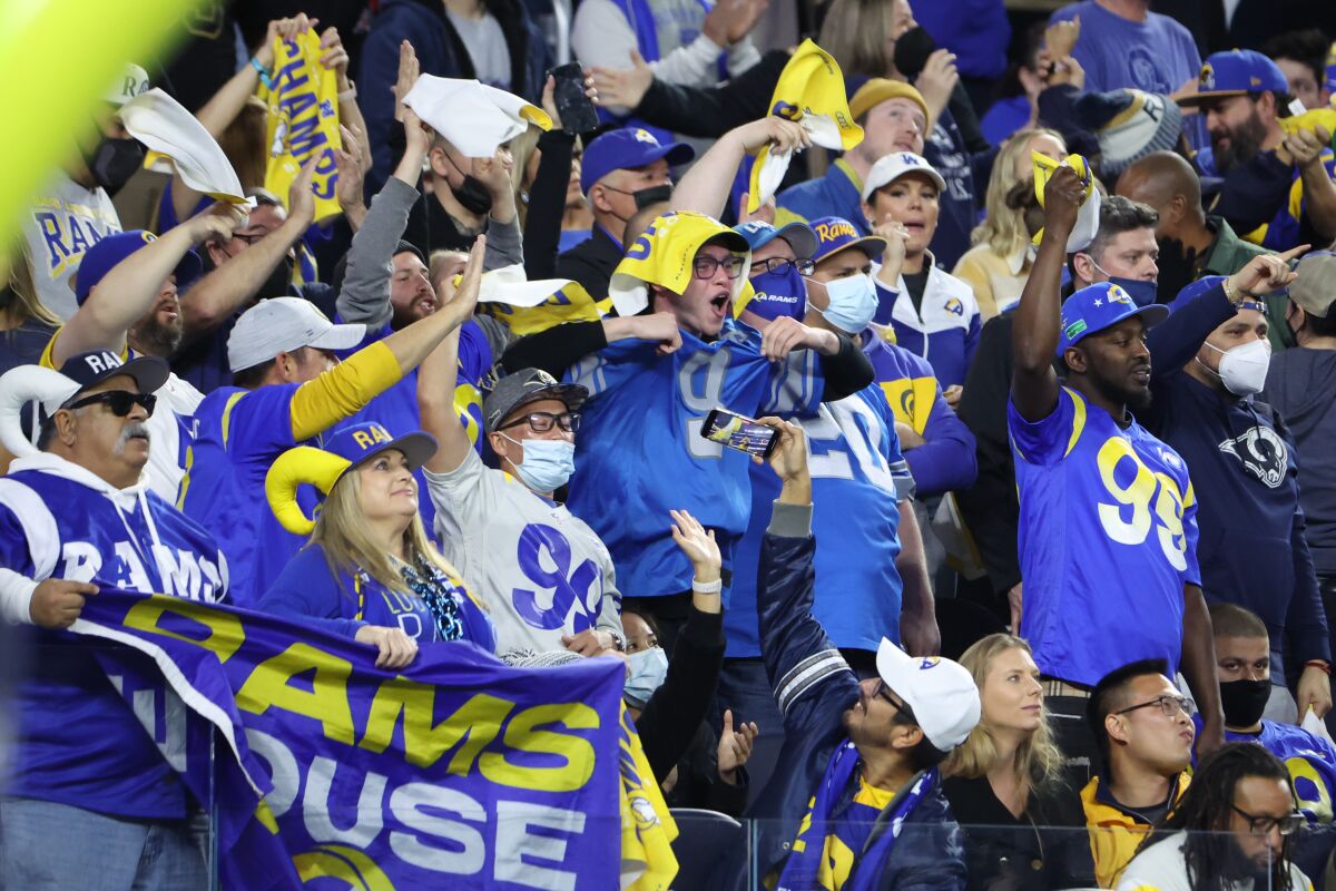 Rams fans cheer during NFC wild-card playoff game against the Cardinals in SoFi Stadium.
