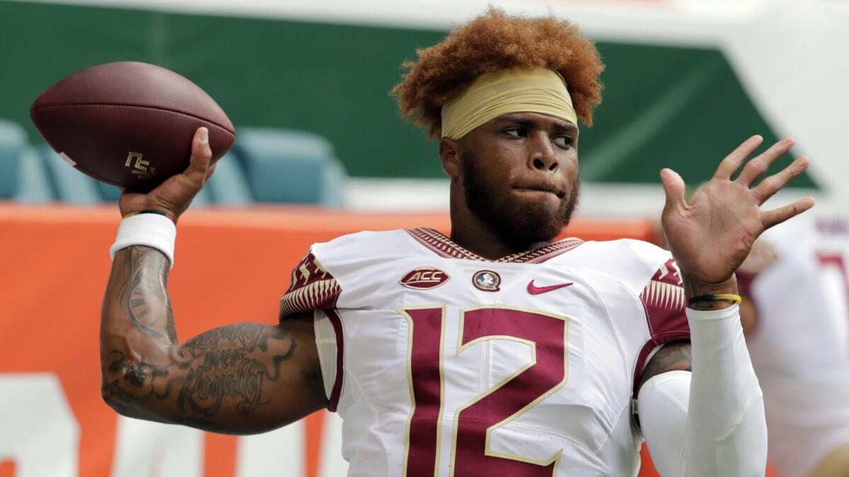 In this Oct. 6, 2018 file photo, Florida State quarterback Deondre Francois (12) warms up before a game against Miami, in Miami Gardens, Fla.