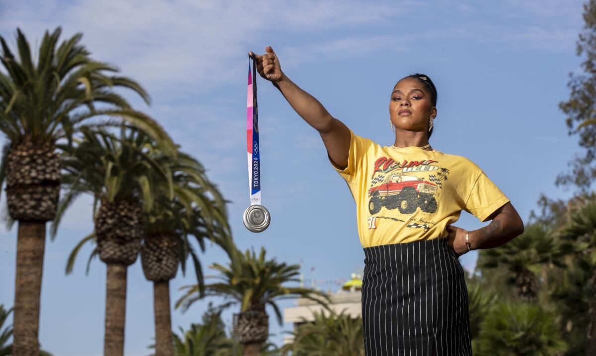 Jordan Chiles holds her Olympic silver medal.