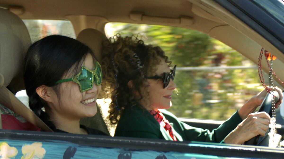 Miya Cech and Rhea Perlman in a car in a scene from the film.