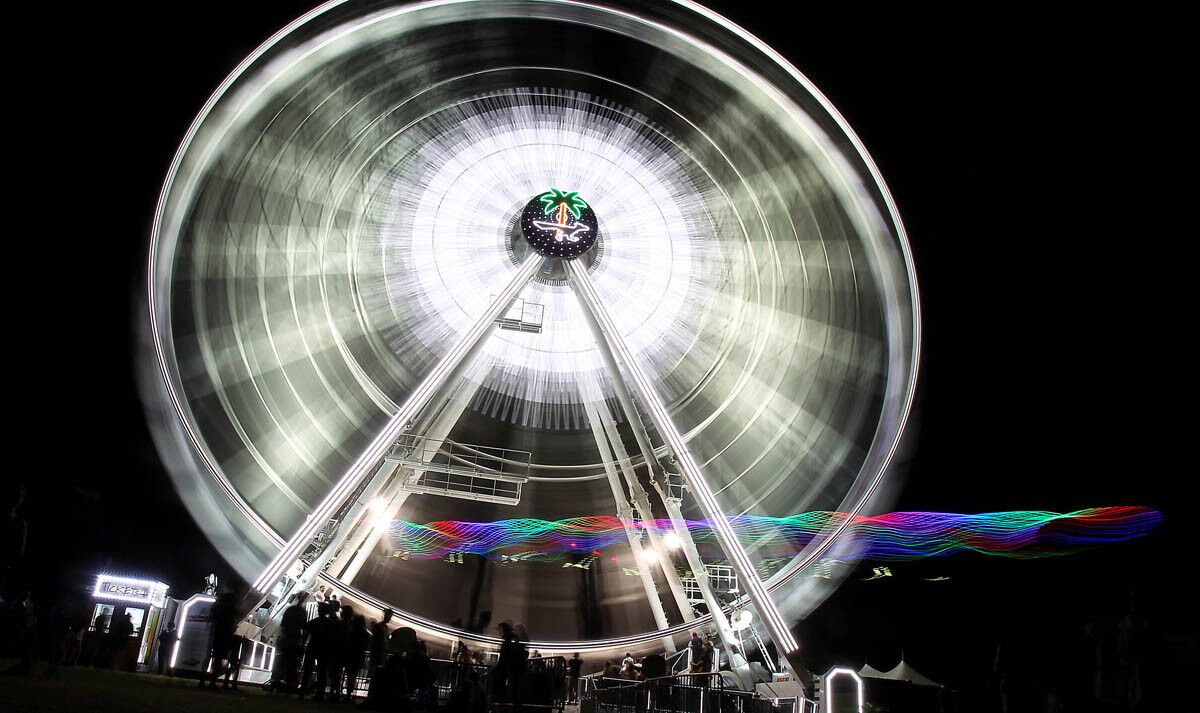 INDIO, CALIF. - APRIL 15, 2017. A Ferris WEheel whirls into the night on day two of the Coachella Music and Arts Festival in Indio on Saturday, April 15, 2017. (Luis Sinco/Los Angeles Times)