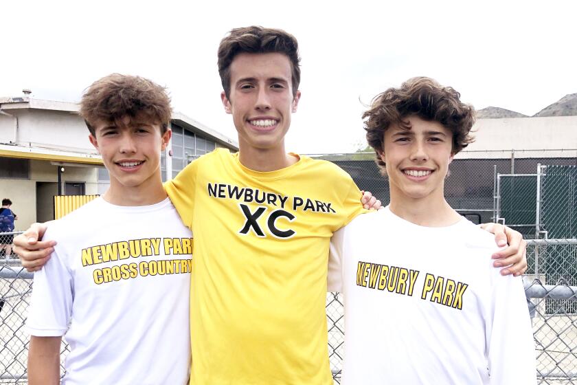 Newbury Park distance standout Nico Young (center) with twin brothers Lex (left) and Leo.