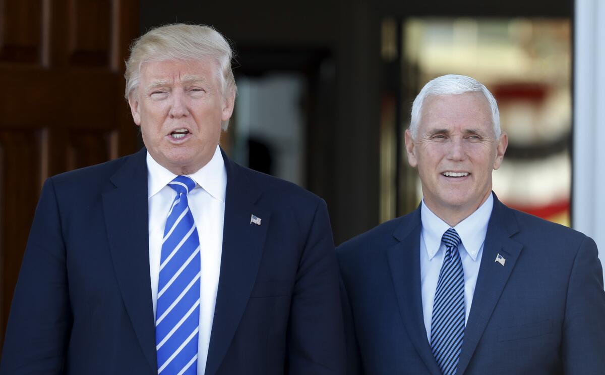 President-elect Donald Trump and Vice President-elect Mike Pence leave the Lamington Presbyterian Church after Sunday services in Bedminster, N.J., on Sunday.