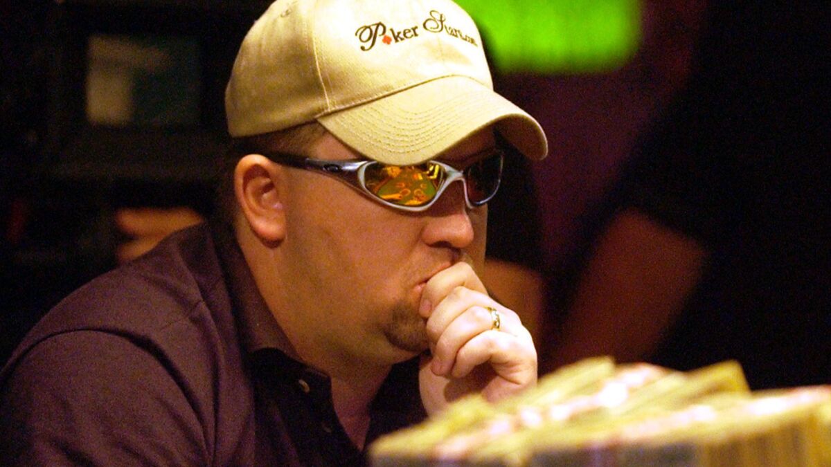 Chris Moneymaker of Spring Hill, Tenn., plays the final hand of the 2003 World Series of Poker at Binion's Horseshoe Casino in Las Vegas. Moneymaker won the $2.5-million tournament after qualifying in a $40 internet tournament.