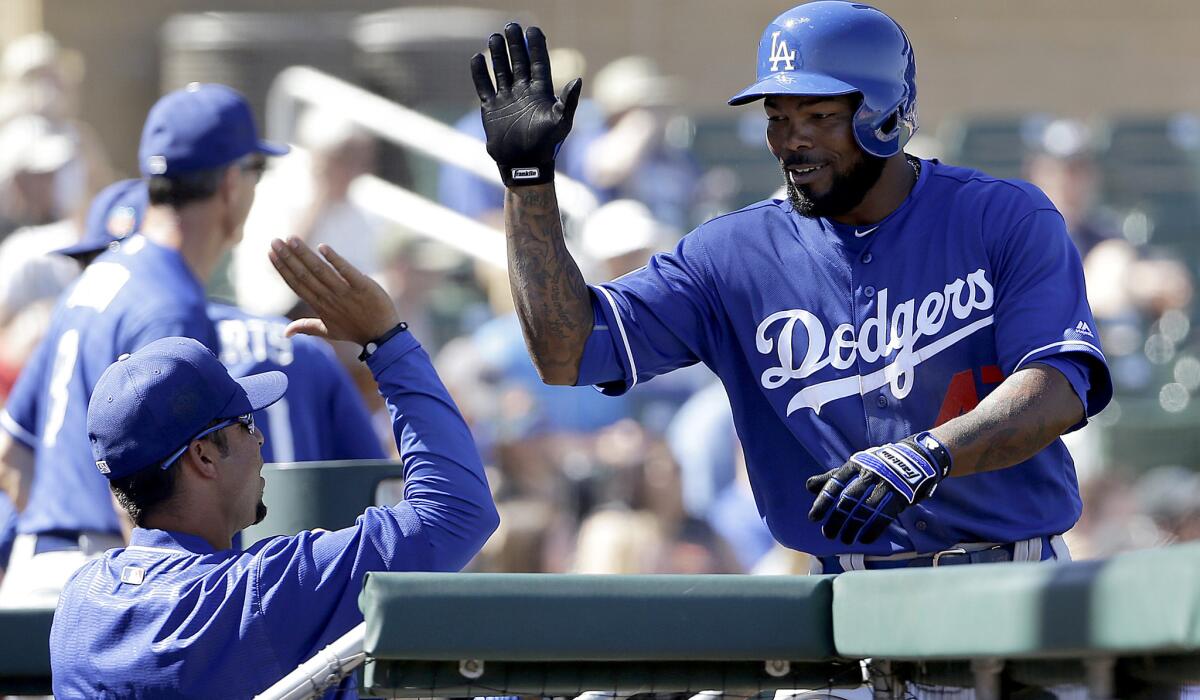 Dodgers second baseman Howie Kendrick, getting congratulated after hitting a home run Friday, raised his Cactus League average to .476 with two more hits Saturday.