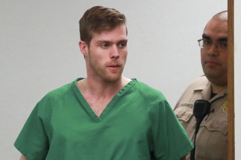 Christian Davis, 29, who has been charged with two counts of attempted murder and other felonies, is escorted into a courtroom for his arraignment at the Vista Courthouse on Wednesday March 4, 2020 in Vista, California. Davis, who pleaded not guilty, drove a U-Haul van into a crowd of people standing in front of a downtown Encinitas bar, seriously injuring two, early Sunday morning, March 1, 2020, after he was thrown out of the bar for being drunk.