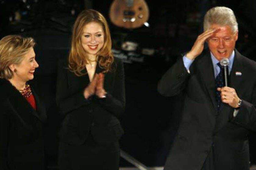 Democratic presidential candidate, Senator Hillary Clinton, is joined by her daughter, Chelsea, and husband, former President Bill Clinton, during a New Years Eve event at the Capitol Square in Downtown Des Moines, Iowa.