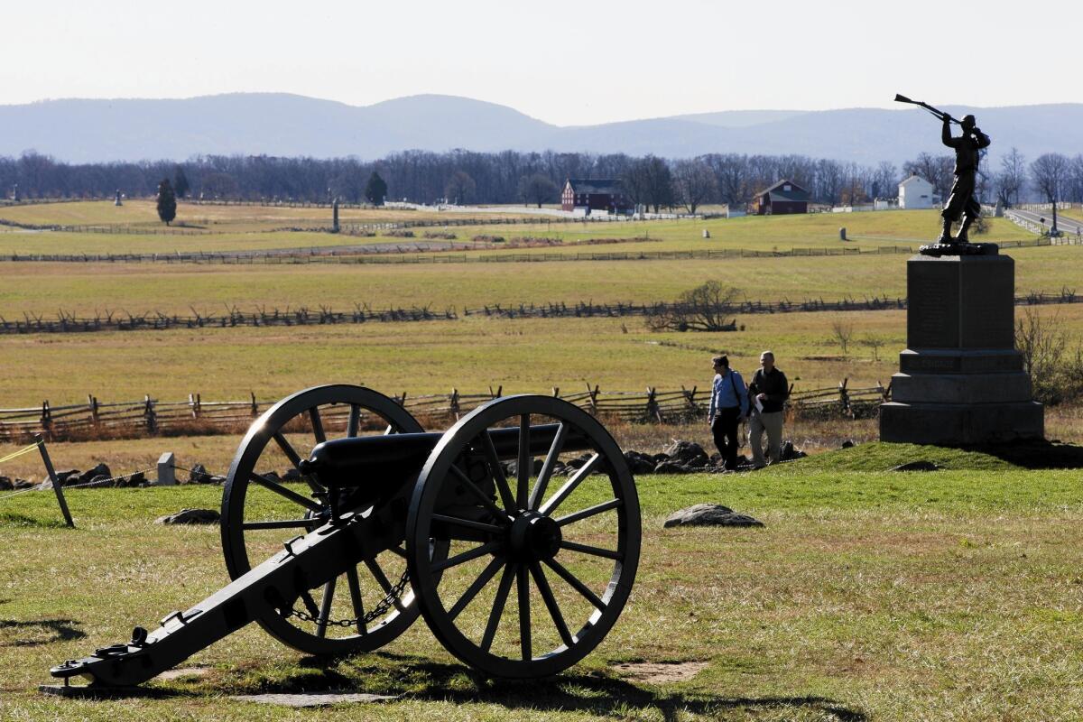 People visit the site of Pickett’s charge in Gettysburg, Pa., where Lt. Alonzo H. Cushing fought and died during the Battle of Gettysburg in 1863.