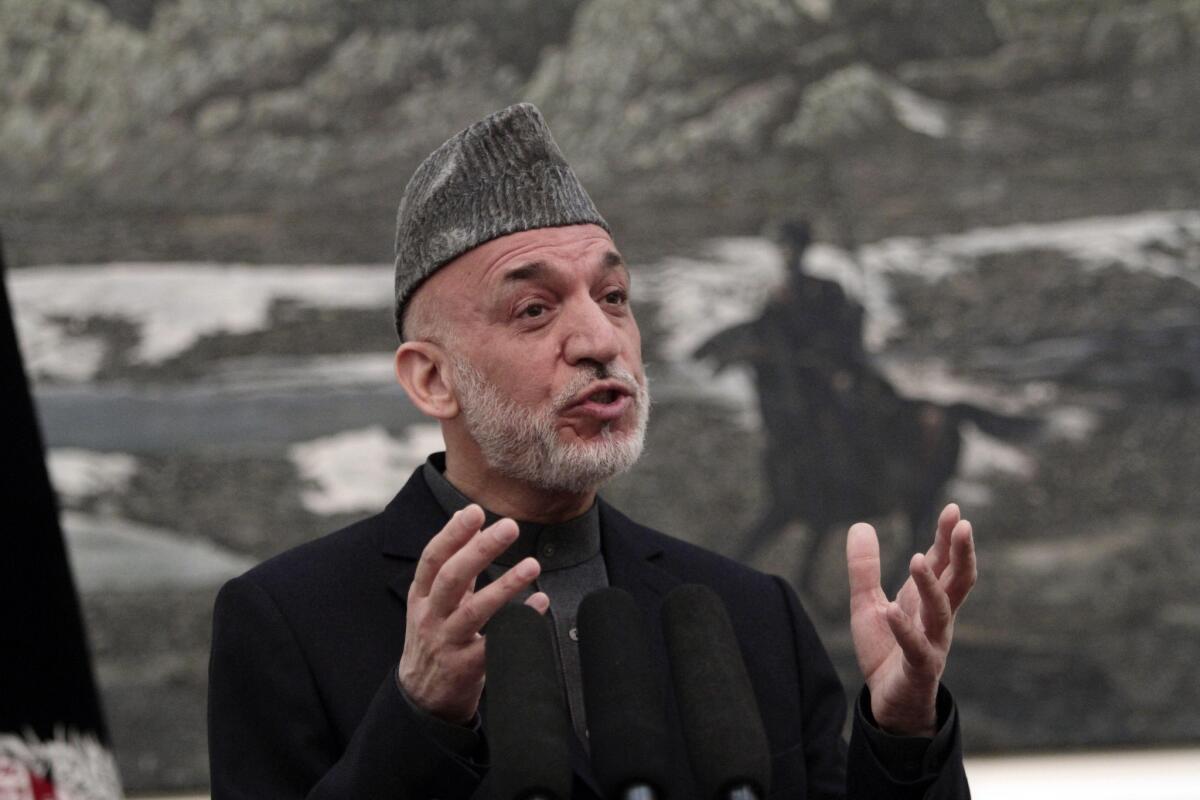 Afghan President Hamid Karzai speaks during a news conference in Kabul.