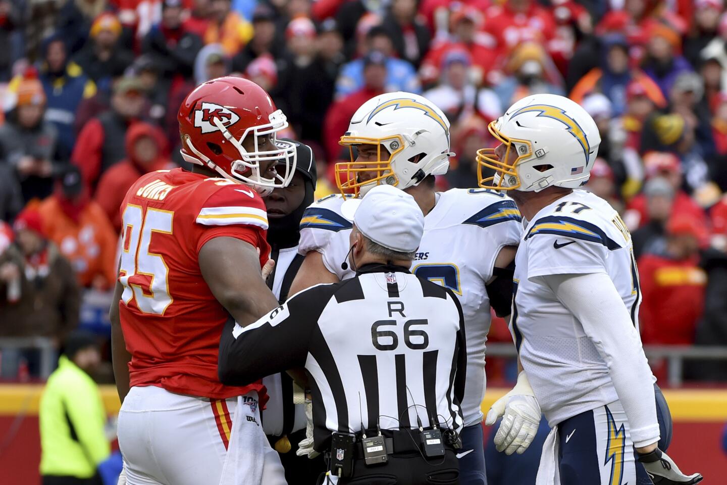 Chiefs defensive tackle Chris Jones (95) and Chargers quarterback Philip Rivers (17) get into it during a game Sunday.