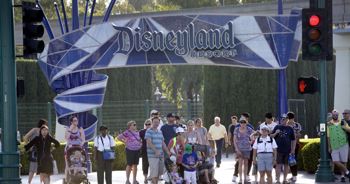 Disneyland plans to keep its gates open through the holidays despite large crowds