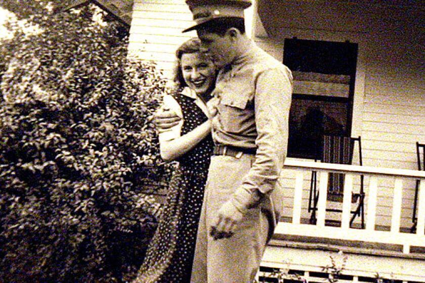 Stanley Dunham gives his wife Madelyn Lee Payne Dunham a hug in a World War II-era family photo. The couple are the maternal grandparents of Sen. Barack Obama. Madelyn Dunham died of cancer Sunday. She was 86.