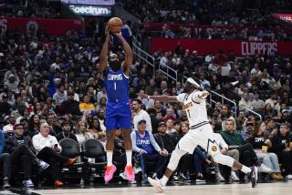Los Angeles Clippers guard James Harden, left, shoots as Denver Nuggets guard Reggie Jackson defends during the second half of an NBA basketball game, Monday, Nov. 27, 2023, in Los Angeles. (AP Photo/Ryan Sun)