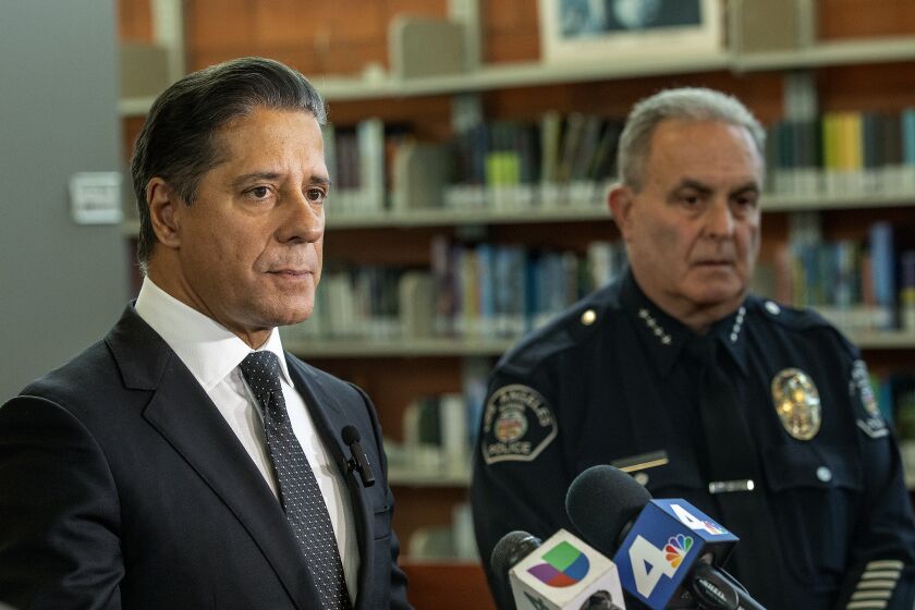 LOS ANGELES, CA-SEPTEMBER 14, 2022: LAUSD Superintendent Alberto Carvalho, left, addresses the media during a press conference at Helen Berrnstein High School in Los Angeles where a 15 year old girl was found dead in the girls bathroom on Tuesday night. Another 15 year old girl and a teenage boy were taken to a hospital. All were victims of drug overdoses. The teenagers brought Percocet that might have been laced with fentanyl. At right is Steven Zipperman, Chief of Police for the L.A. School Police Department. (Mel Melcon/Los Angeles Times)