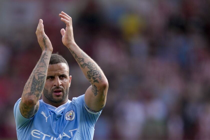 Manchester City's Kyle Walker greets fans at the end of the English Premier League soccer match between Brentford and Manchester City at the Gtech Community Stadium in London, Sunday, May 28, 2023. (AP Photo/Kirsty Wigglesworth)