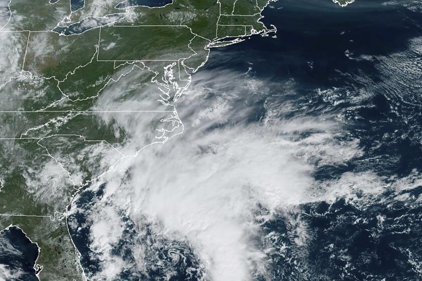This Thursday, Sept. 21, 2023, satellite image provided by the National Oceanic and Atmospheric Administration shows a potential tropical cyclone forming off the southeastern coast of the United States in the Atlantic Ocean. (NOAA via AP)