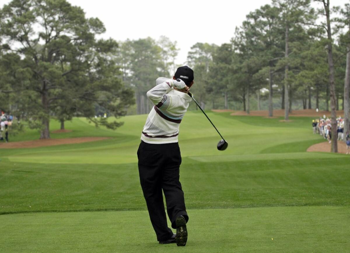 In this April 8, 2008, file photo, Toru Taniguchi of Japan tees off on the 17th hole at Augusta National in Georgia, with the Eisenhower Tree at left.