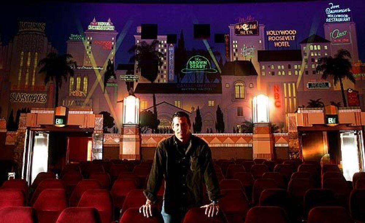 Owner Robert Bucksbaum stands inside his single-screen Crest Theater in Westwood. Opened in 1940, the structure is on its way to being declared a historic-cultural monument.