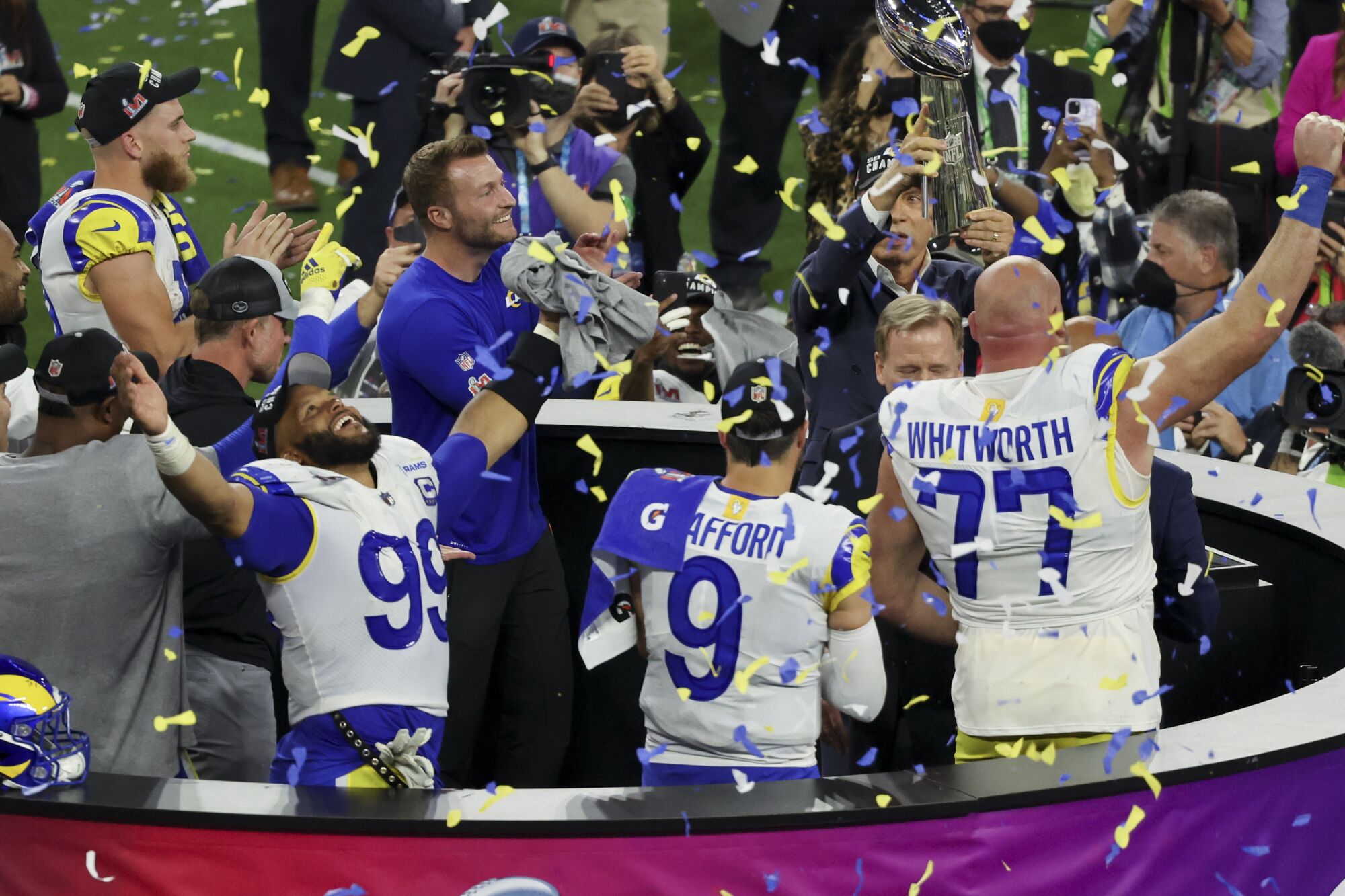 Rams coach Sean McVay and players Aaron Donald, left, Matthew Stafford and Andrew Whitworth celebrate.